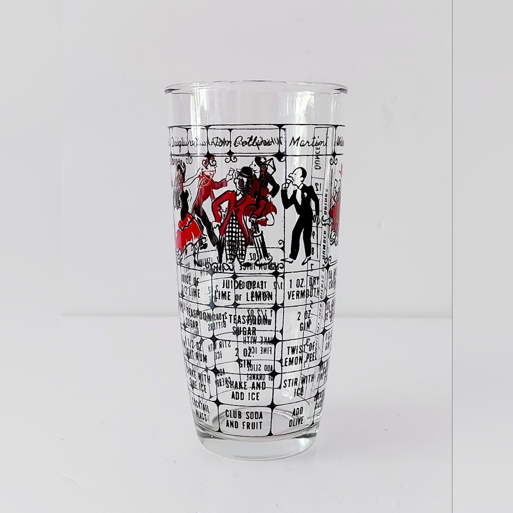 Mixing glass for cocktails with printed recipes.